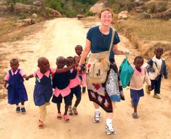 Image of Peace Corp worker with children